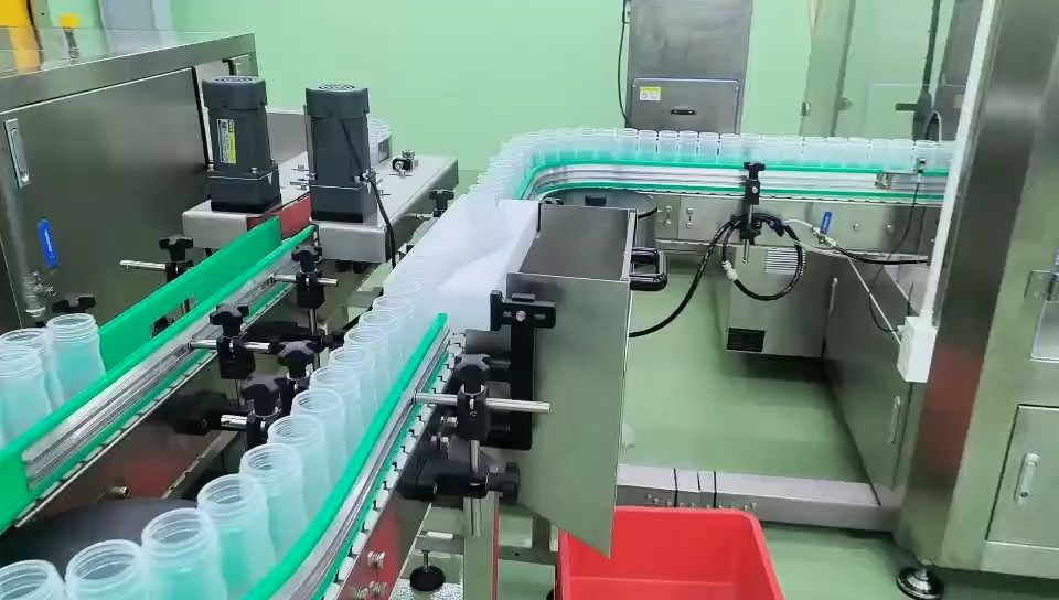 Empty bottles on the seasoning salt line conveyor at the Vietnam factory